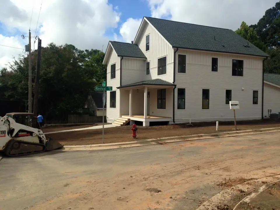Newly constructed home with cleared yard ready for landscaping in Raleigh, NC